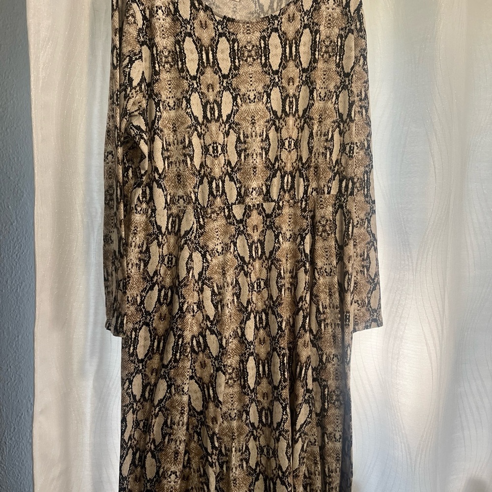 A beautiful soul, black and tan dress size which equals a 3X